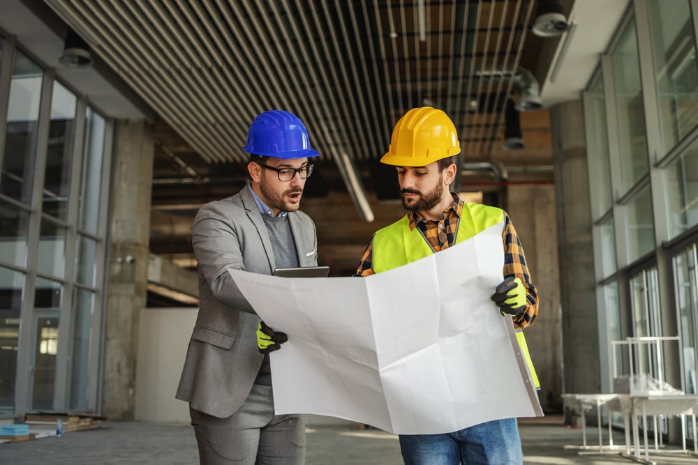 contractor and official going over a project