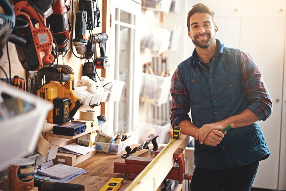 contractor smiling over his tools