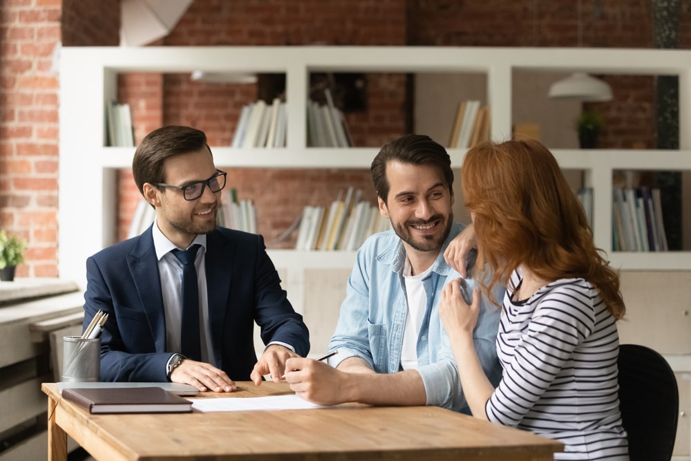 insurance agent talking to couple about life coverage