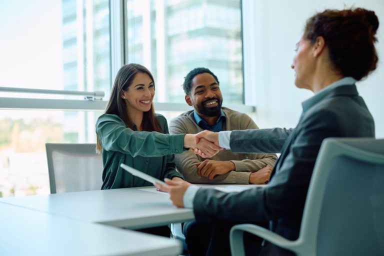 insurance agent talking to clients