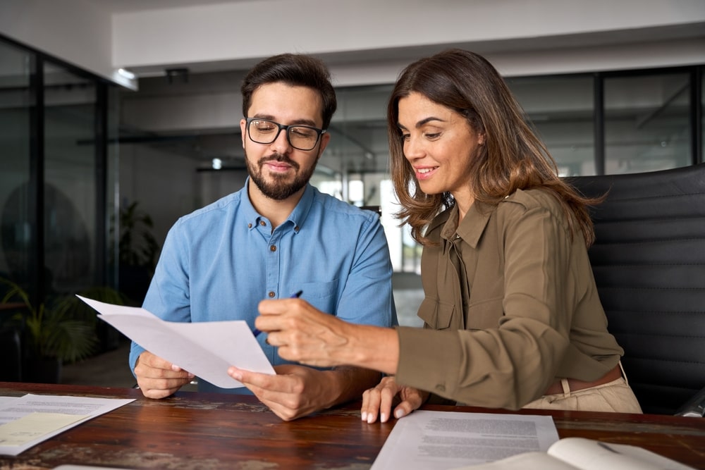 insurance agent going over paperwork with client