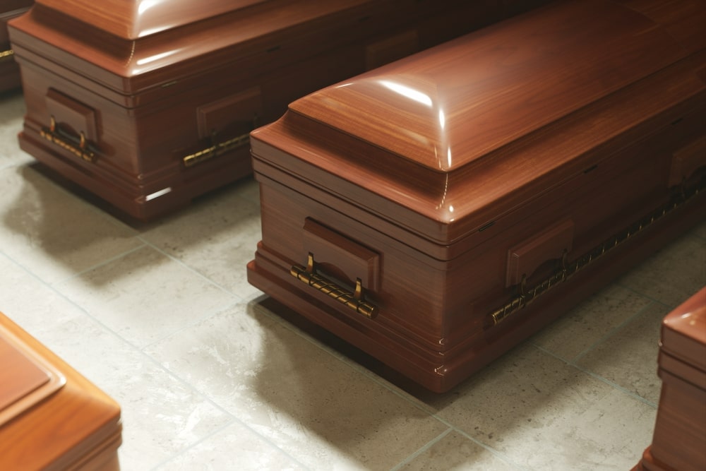 Traditional wooden casket with polished finish and brass handles