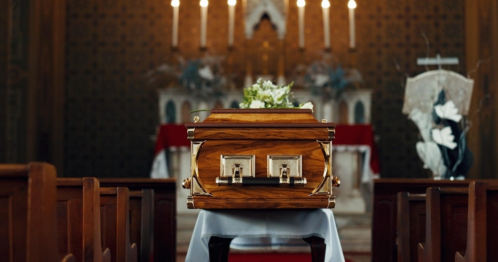 Modern casket displayed in a funeral home showroom